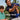 Man with Johnnie-o shirt on, and child outdoors with text 'Lookin' Good,  Shop Now'
